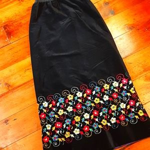 Vintage black velvet maxi skirt with extensive embroidery.